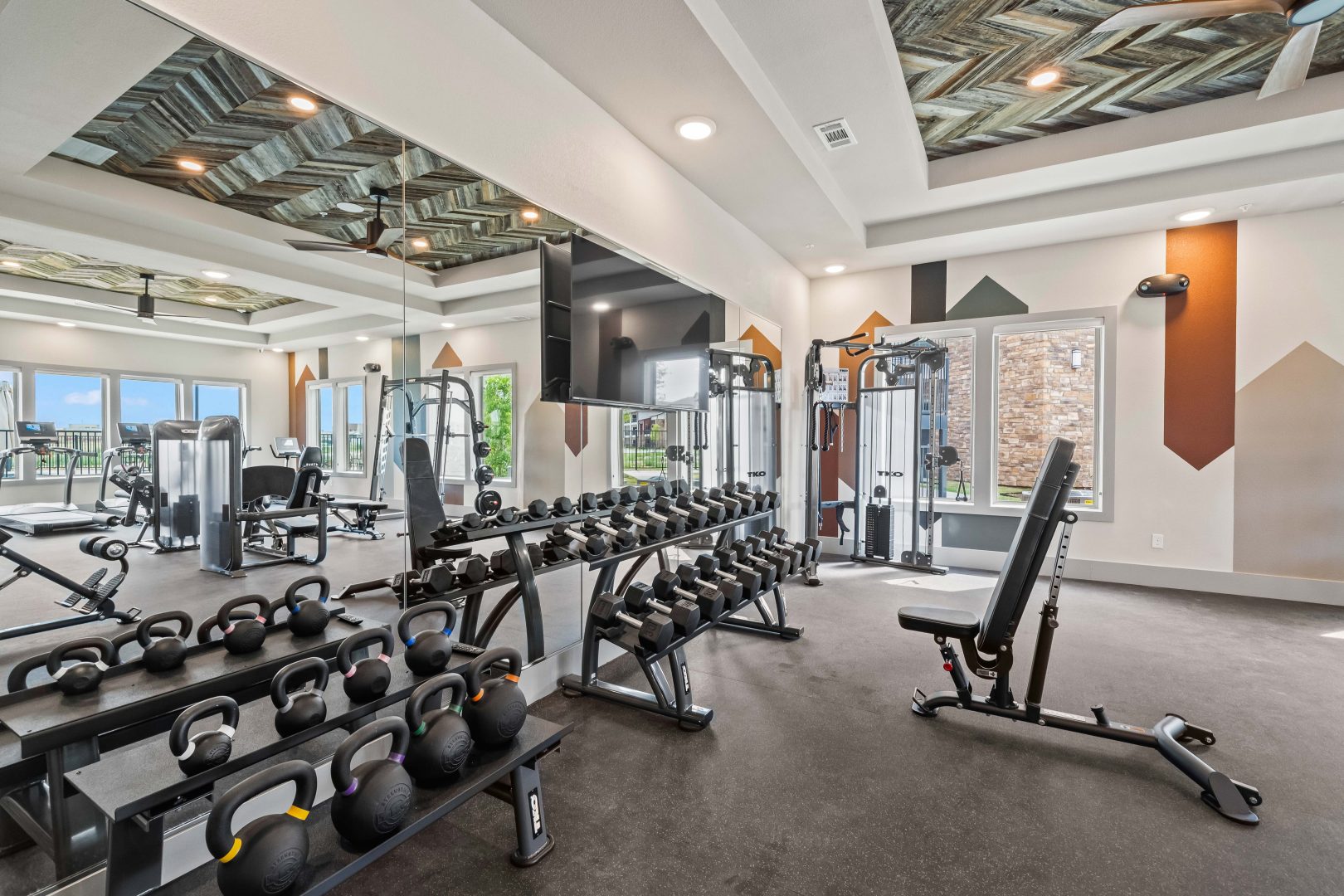 a gym room with weights and exercise equipment at The La Ventana